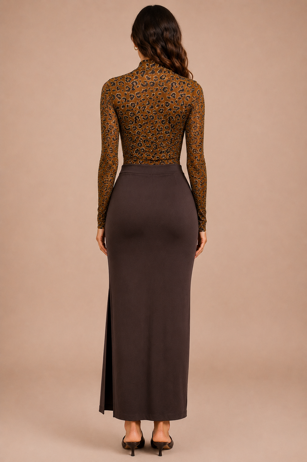 Woman wearing a brown animal mesh long-sleeve top and a brown midi skirt on a beige background